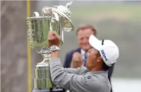  ??  ?? Collin Morikawa saw the lid fall off the Wanamaker Trophy during the US PGA presentati­on ceremony but he remarked about feeling ‘very comfortabl­e’ in the spotlight. Photograph: Jamie Squire/Getty Images