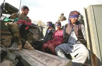  ??  ?? File photo shows Taliban militants arrested by Afghan security forces sit on a vehicle during a presentati­on to the media, in Jalalabad, Afghanista­n. — Reuters photo