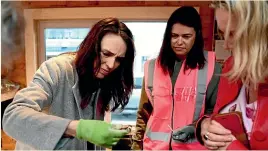  ?? GETTY IMAGES ?? Prime Minister Jacinda Ardern looks through collected rubbish during a visit to Sustainabl­e Coastlines at the Flagship yesterday in Auckland.