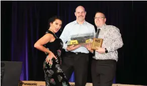  ??  ?? Jackie Clarke and Warrik Skulve with Matt Clark, from Bensons Auto Electrical, receiving an award.