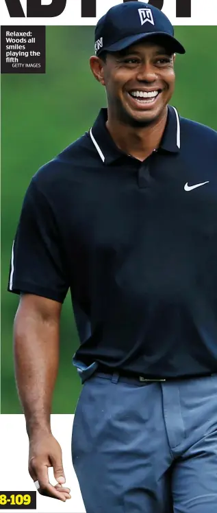  ?? GETTY IMAGES ?? Relaxed: Woods all smiles playing the fifth