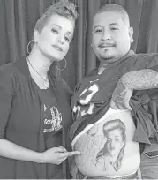  ?? Courtesy photo ?? Angel Aviles with a fan who has a tattoo of her character, Sad Girl, from the film “Mi Vida Loca.”