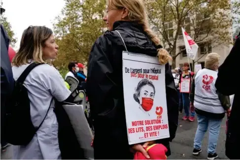  ?? (AP) ?? P rotesters gather outside the Hea l th Ministry in Paris on Tuesday