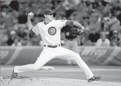  ?? Associated Press ?? Chicago Cubs starting pitcher Kyle Hendricks delivers during the first inning of a baseball game against the Pittsburgh Pirates on Tuesday in Chicago.