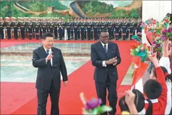  ?? RAO AIMIN / XINHUA ?? President Xi Jinping waves at children as he welcomes Namibian President Hage Geingob during a ceremony at the Great Hall of the People in Beijing on Thursday.