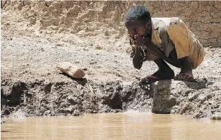  ?? THOMAS MUKOYA/AFP/GETTY IMAGES ?? Water is increasing­ly used as a weapon of war to punish and threaten civilians, a situation made worse by climate change as freshwater sources shrink.