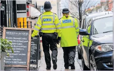  ?? Picture: ALAMY ?? MEAN STREETS: More bobbies on the beat and stop-and-search would make us safer