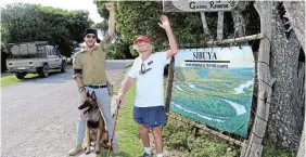  ?? ?? LONG WALK: Jack McLeod, 66, accompanie­d by Sibuya anti-poaching partners Justin Fox and Belgian Mallinois Ollie during the last few kilometres of his 12-hour walk from Salem, reaches the Sibuya Game Reserve reception in Eastbourne Road, Kenton-On-Sea, at about 4pm on Friday November 25.