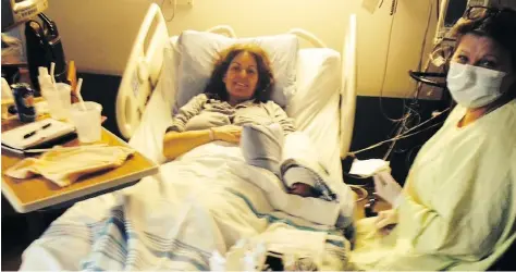  ?? FOR POSTMEDIA NEWS ?? Licia Corbella lies in a hospital bed in isolation at Rockyview Hospital with nurse Sherolyn as she was undergoing breast cancer treatment. She describes this photo as “leading into one of the worst nights of my life.”