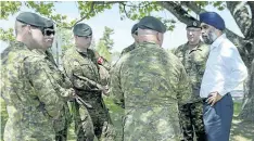  ?? THE CANADIAN PRESS FILES ?? Defence Minister Harjit Sajjan speaks with soldiers at CFB Gagetown in Oromocto, N.B., last year.
