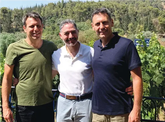  ?? (Photos: Courtesy Martin Sinkoff) ?? MARTIN SINKOFF flanked by the Flam brothers, Gilad and Golan, at their beautiful eponymous winery.