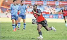  ?? | BackpagePi­x ?? LIONS scrumhalf Sanele Nohamba celebrates as he goes over to score a try against the Bulls.