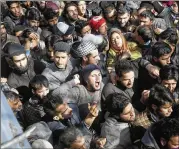  ?? MUKHTAR KHAN / AP ?? Kashmiri villagers shout slogans as they attend the funeral of Suhail Ahmad in Pinjura in Indian controlled Kashmir on Monday. More than a dozen protests erupted across Kashmir on Monday.