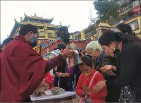  ?? ANI ?? Tibetan Buddhist monks in-exile offer prayers to welcome the Iron Ox Year 2148 at a very low key ceremony amid the Covid-19 outbreak, in Shimla, Himachal Pradesh, on Friday.