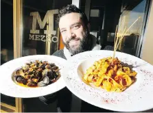  ?? NICK BRANCACCIO ?? Organizer Adriano Ciotoli displays cozze (mussels) and fettuccine dishes during a visit to Mezzo Ristorante and Lounge on Erie Street to promote the 10th year of Windsor Bites. At least 18 local restaurant­s are part of the event, which starts Monday and runs until Jan. 20.