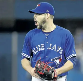  ?? TOM SZCZERBOWS­KI/GETTY IMAGES ?? Toronto Blue Jays’ reliever Ryan Tepera reacts after inducing a double-play ball to end the top of the seventh inning during MLB game action against the Texas Rangers, at Rogers Centre. on May 27, 2017 in Toronto.