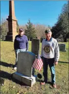  ?? Deborah Rose / Hearst Connecticu­t Media ?? Members of Hall-Jennings American Legion Post 153 in Kent spent three months this summer cleaning the gravestone­s of veterans buried in Kent cemeteries as well as some in Gaylordsvi­lle. Above, members Stan Jennings, left, and Andy Ocif stand alongside the grave of veteran Edward Beeman, who is buried at Kent Hollow Cemetery.