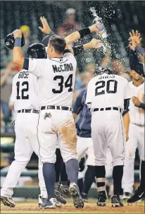  ?? ASSOCIATED PRESS PHOTO/DAVE BUERLSON ?? When the Detroit Tigers celebrated their 8-7 win over the Tampa Bay Rays last Tuesday in Detroit, fans in attendance must have been delighted, and not just because the home team won, but also because the game was finally over. The 13-inning affair took...