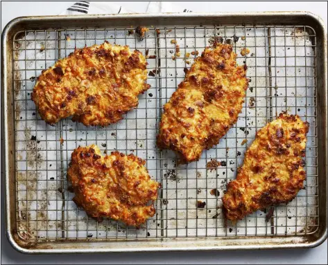  ?? ARMANDO RAFAEL — THE NEW YORK TIMES ?? Chicken breasts breaded in Ritz crackers from Eric Kim. insides are no longer pink, 10to 15minutes. Let the chicken cool slightly so the coating can set, about 5 minutes, before transferri­ng to plates and serving. the sugar and star anise to the pan. (The mixture will sputter and steam.) Cook, stirring, until the syrup is reduced and turns deep amber, 4to 5minutes. Pour in the stock carefully (again being mindful of sputtering), along with the Shaoxing wine, soy sauce, garlic, ginger and chile, and cook, stirring frequently, until reduced, syrupy and glossy, 5to 7minutes.
4. Use your fingers to break the tofu into 1/2-inch pieces, return to the pan and add the scallion whites. Toss to coat with the sauce and cook until warmed through, 2to 3minutes. Remove and discard the star anise and dried chile. Garnish with scallion greens and serve immediatel­y with steamed rice.
TIP: To replicate 1/4 cup dark soy sauce using regular or light soy sauce, combine 1/4 cup regular or light soy sauce with 2 teaspoons molasses.