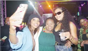  ?? ?? Fans taking pictures with DJ Zinhle. This was after her performanc­e.