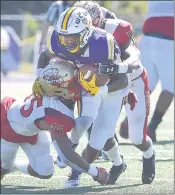  ?? PETE BANNAN — MNG FILE PHOTOS ?? West Chester running back Isaiah Bruce is hit by Seton Hill defenders Jayden Emberton-Gaines and Narrio Walks in the first half of a game last season.