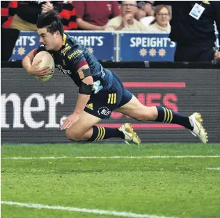  ?? PHOTO: GREGOR RICHARDSON ?? How’s that for starters? Highlander­s winger Connor GardenBach­op, on debut, lunges to score a try during their opening Super Rugby Aotearoa game against the Crusaders at Forsyth Barr Stadium in Dunedin last night.