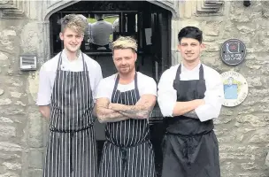  ??  ?? Tommy Heaney, centre, of Leicester’s Restaurant at the Great House Hotel in Laleston, Bridgend, is taking part in the Great British Menu