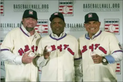  ?? THE ASSOCIATED PRESS ?? Hall of Fame inductees Jeff Bagwell, left, Tim Raines, center, and Ivan Rodriguez, pose for a photo during a news conference in New York.