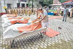  ?? PTI ?? Assam chief minister Himanta Biswa Sarma pays homage to the six Assam Police personnel who died in Monday's clashes at Lailapur on the Assam-Mizoram border.