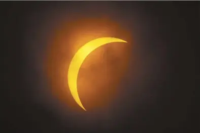  ?? AP photo ?? The moon partially covers the sun during a total solar eclipse, as seen from Eagle Pass, Texas on Monday.