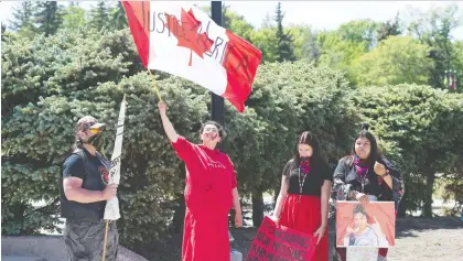  ?? BRANDON HARDER ?? A small group gathered at the Legislativ­e Building on Friday for a rally to remember murdered and missing Indigenous women.