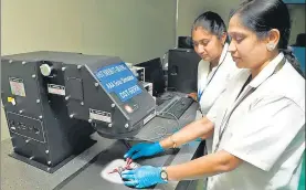  ?? PHOTOS: HTCS ?? Dr A Nirmala Grace (right), with her PhD student G Subashini, testing the assembled solar cell with 1Sun class AAA solar simulator