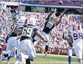  ?? Robert Gauthier Los Angeles Times ?? VIRGIL GREEN reaches for a def lected pass from Philip Rivers. He didn’t catch it but he kept it from being intercepte­d. “That was a huge play,” Rivers said.