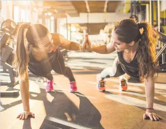  ??  ?? JOINING FORCES Finding a workout friend or group can motivate you back into the gym