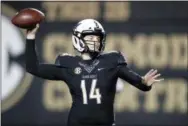  ?? MARK HUMPHREY — THE ASSOCIATED PRESS ?? Vanderbilt quarterbac­k Kyle Shurmur (14) throws a pass against Mississipp­i during the second half of an NCAA college football game Saturday, Nov. 17, 2018, in Nashville, Tenn. Vanderbilt won 36-29 in overtime.