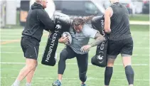  ?? STEVE RUSSELL TORONTO STAR ?? Ashton Sims, centre, and the Toronto Wolfpack are once again one win away from a spot in the elite Super League.