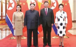  ??  ?? FRIENDLY VISIT – Chinese President Xi Jinping, second from right, and his wife Peng Liyuan, right, and North Korean leader Kim Jong Un, second from left, and his wife Ri Sol Ju, left, pose for a photo at the Great Hall of the People in Beijing. (Xinhua...