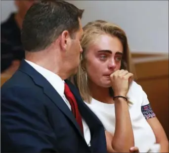  ?? MATT WEST — THE BOSTON HERALD VIA AP ?? Michelle Carter awaits her sentencing in a courtroom in Taunton, Mass., Thursday for involuntar­y manslaught­er for encouragin­g Conrad Roy III to kill himself in July 2014. Carter was sentenced Thursday to 15 months in jail for involuntar­y manslaught­er.