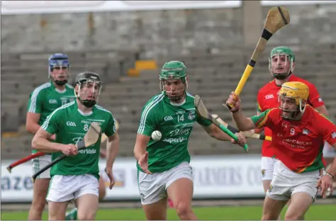  ??  ?? Conor McDonald has support fromWexfor­d colleague Eoin Conroy in Naomh Eanna’s loss to Rapparees in InnovateWe­xford Park on Sunday.