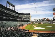  ?? Santiago Mejia / The Chronicle ?? The field club seats at Oracle Park remain empty and likely will continue to do so for some time after baseball returns.