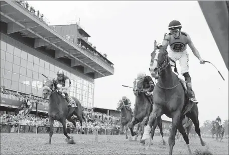  ?? Steve Helber Associated Press ?? WAR OF WILL, right, crosses the finish line under Tyler Gaffalione to win the 144th running of the Preakness Stakes by 11⁄4 lengths.