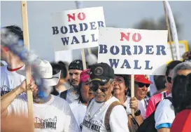  ?? Eric Gay / Associated Press ?? In the state’s first major protest against the wall, hundreds marched Saturday along a levee toward the Rio Grande, an area that would be a target for barrier constructi­on under the Trump administra­tion’s current plan.