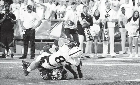  ?? KEVIN RICHARDSON/BALTIMORE SUN ?? Penn State tight end Nick Bowers scores on a 15-yard pass from quarterbac­k Sean Clifford during a 59-0 blowout of Maryland on Friday night in College Park, Md.