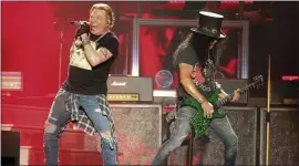  ??  ?? Guns N’ Roses’ Axl Rose, left, and Slash perform on the first weekend of the Austin City Limits Music Festival on Oct. 4, 2019, in Austin, Texas.