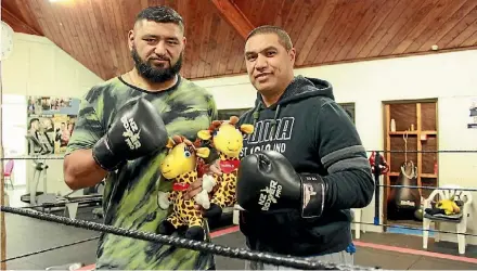  ??  ?? Matthew Paraha and Tamatea Puru are set to fight for the Life Education Trust. They hold Life Education mascot Harold.