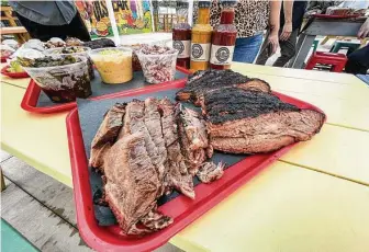  ?? Photos by J.C. Reid / Contributo­r ?? Beef shoulder clod and brisket are available at Dozier’s BBQ.