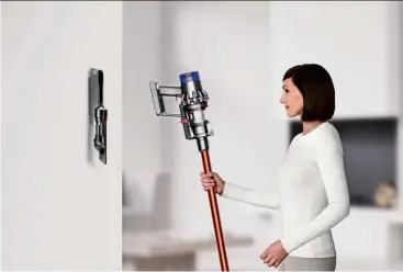  ??  ?? Portable and lightweigh­t, the Dyson Cyclone V10 makes vacuuming an effortless task. Its wall-mounted dock enables neat storage and easy access for cleaning on the go.