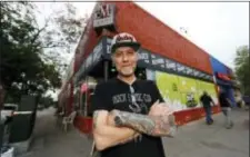  ?? DAVID ZALUBOWSKI — THE ASSOCIATED PRESS ?? In this Sunday photo, Jim Norris poses for a photo outside of his informatio­n cafe called Mutiny in south Denver. Norris is hoping to license his storefront as one of the nation’s first legal marijuana clubs.