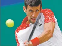  ?? ANDY WONG/ASSOCIATED PRESS ?? Novak Djokovic easily beat Marco Cecchinato 6-4, 6-0 on Thursday to reach the quarterfin­als of the Shanghai Masters in Shanghai, China.