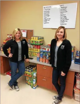  ?? CHAD FELTON — THE NEWS-HERALD ?? Program Coordinato­rs Meredith Everett, left, and Tracy Stanek at End 68 Hours of Hunger Lake County located at 1223 Mentor Ave. in Painesvill­e on Feb. 27.